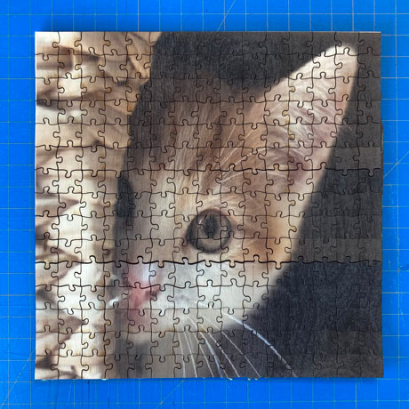 Laser cut jigsaw puzzle with UV printed image of kitten 