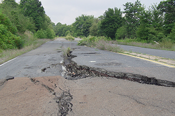 cracked and weather-damaged road